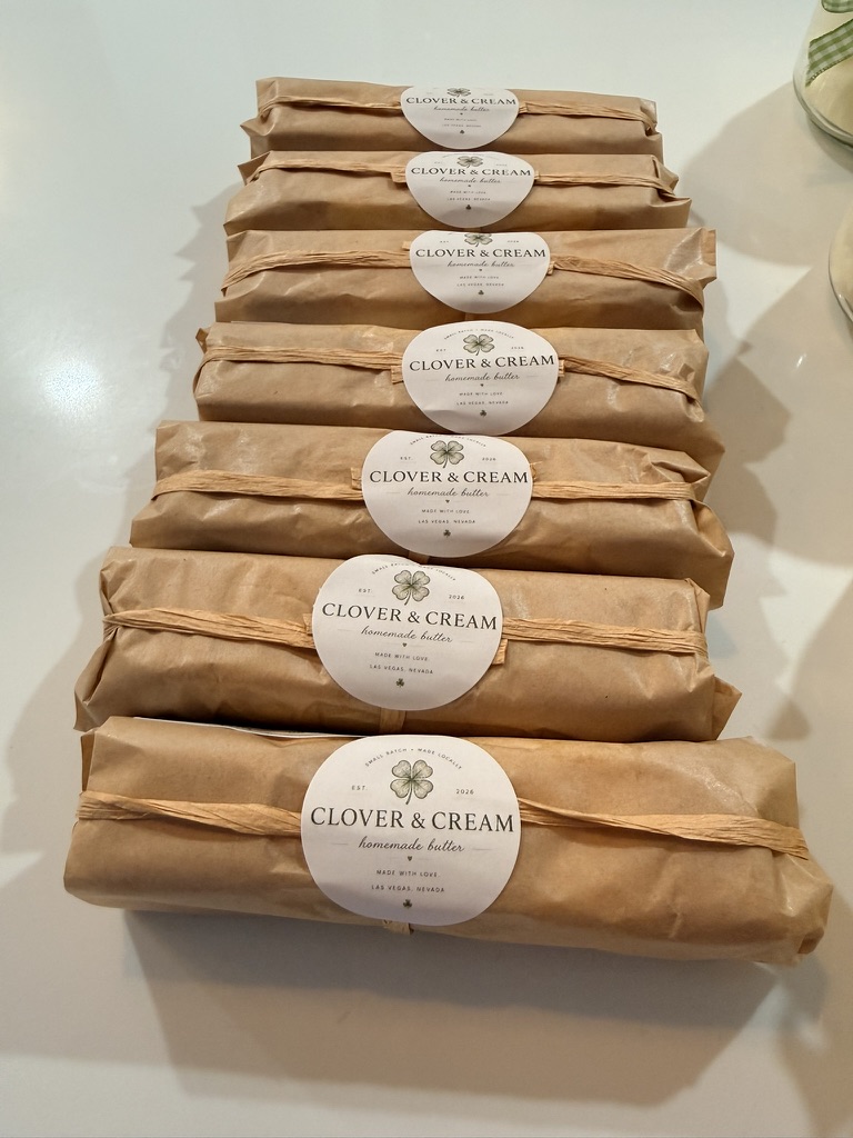 Clover butter wrapped in brown paper with round clover labels